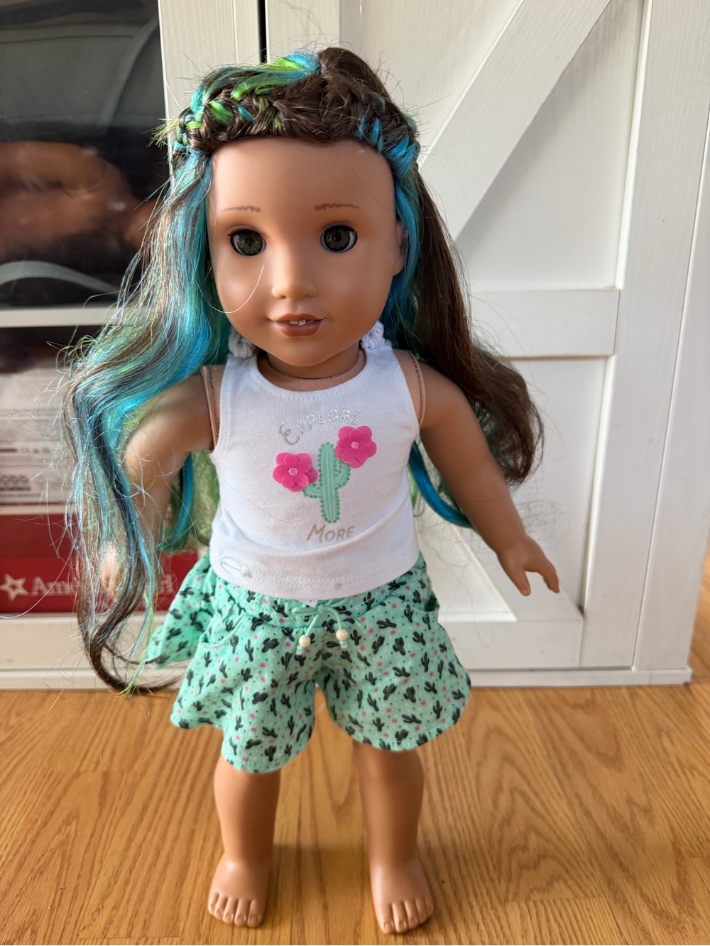 American Girl Doll with Brown Hair and Blue Highlights in White Cactus Tank